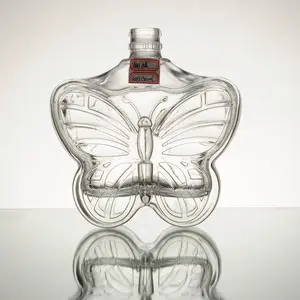Bottle liquor glass bottle high quality butterfly shape 500ml whiskey embossed 10000 TT Paypal West union