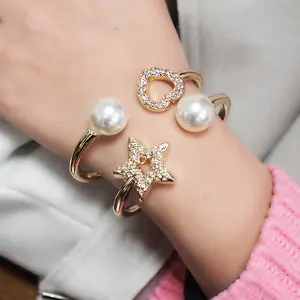 HANSIDON-pulsera elegante de estrella de perla para mujer, amuleto de brazalete con corazón de Metal, pulsera de diamantes de imitación, joyería