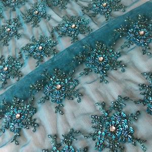 Tissu en dentelle de tulle uni brodé à la machine avec de lourds cristaux et strass pour robes de mariée et chaussures - Product Image 1