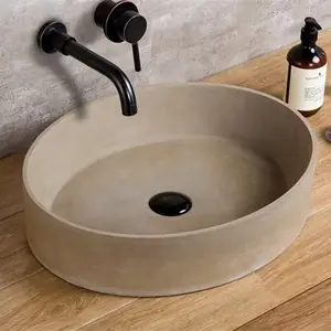 Lavabo modello ovale in cemento grigio chiaro