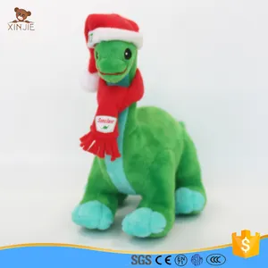 Зеленая плюшевая игрушка динозавр с шарфом и шляпой