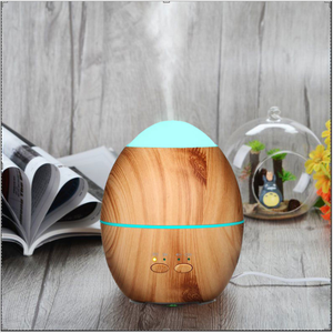 เครื่องพ่นไอน้ำอัลตร้าโซนิคกลิ่นไม้รูปไข่ขนาด300มล. พร้อมไฟ <span class=keywords><strong>LED</strong></span> สีสันสดใสเครื่องเพิ่มความชื้นในอากาศที่ใช้ในร้านเสริมสวยของโรงแรม - Product Image 4