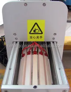 Travelling roll film surface corona treatment machine