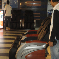 Fauteuil de massage automatique acceptant les pièces d'euros