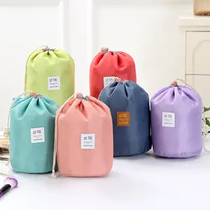 Wholesale Nylon Barrel Shaped Drawstring cosmetic Storage bag for travel.