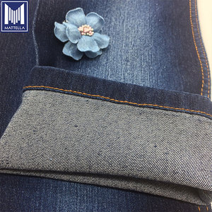 Tela de mezclilla elástica para mujer para jeans sarga 3/1 algodón Poliéster Viscosa Spandex hilo teñido patrón tejido