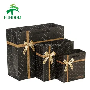 luxurious matte lamination bowknot black paper reusable shopping bag with gold polka dots