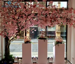 人工桜の木の枝つる籐屋内リビングルーム植物壁の装飾造園