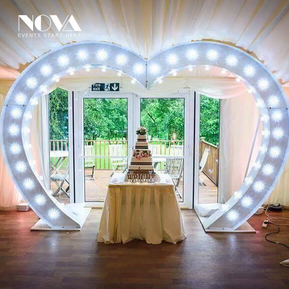 illuminated heart shape wedding arch decoration at stage wedding event led lighting