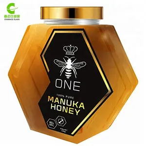 500g Zeshoekige vorm glas honing potten met gouden deksels goedkope