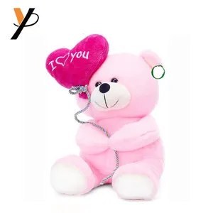 Plush teddy bear with heart shaped balloon