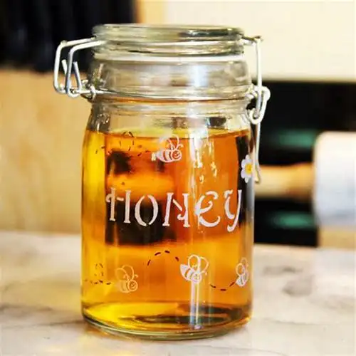 Wholesale honey jar glass Hot selling jar glass honey with metal lid cheap for glass jar honey canning food safe daily