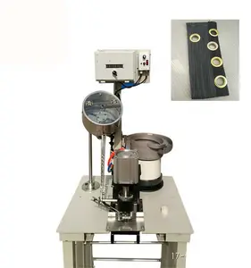 Pneumatic eyelet punching machine