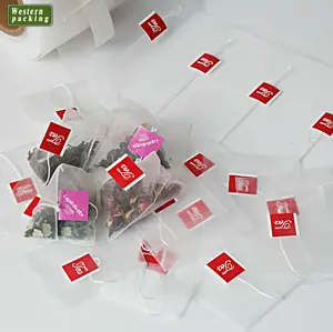 Чайный пакетик в виде пирамиды из нейлоновой сетки с листьями