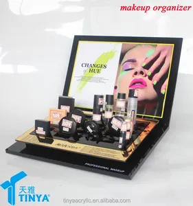 Mostrador de maquillaje organizador lucite en exhibición para la tienda de maquillaje profesional con la etiqueta engomada