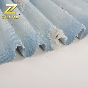 Stock de material de algodón de tejido elástico denim con perforación tratamiento para hombre bolsa