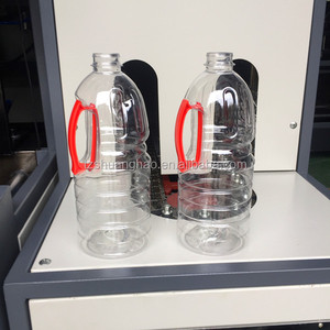 Vente chaude semi-automatique bouteille d'huile pet soufflage moule machine de moulage pour bouteille d'huile <span class=keywords><strong>comestible</strong></span> avec insert de poignée latérale - Product Image 1
