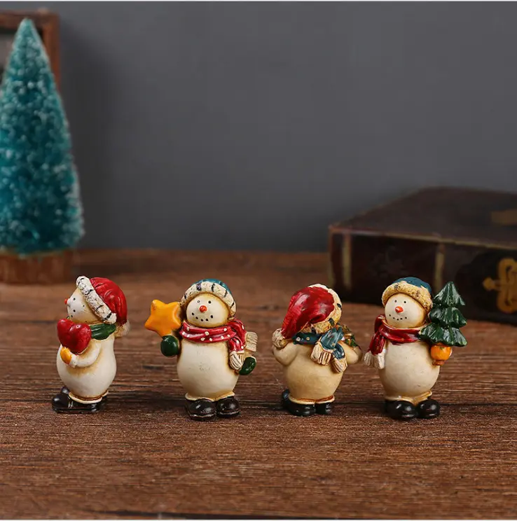 American village a set of four resin Christmas snowman decoration ornaments