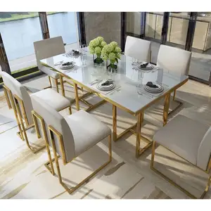फैक्टरी प्रत्यक्ष बिक्री आधुनिक संगमरमर शीर्ष सोने स्टेनलेस स्टील फ्रेम खाने की मेज सेट के लिए 6 कुर्सी