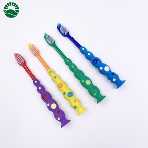 Cepillo de dientes con forma de palos para niños, con tomates clásicos y ventosas - Product Image 1