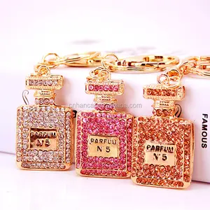 Botella de <span class=keywords><strong>Perfume</strong></span> con diamantes de imitación para hombre y mujer, llavero de aleación, accesorios, colgante, llavero, dijes - Product Image 1