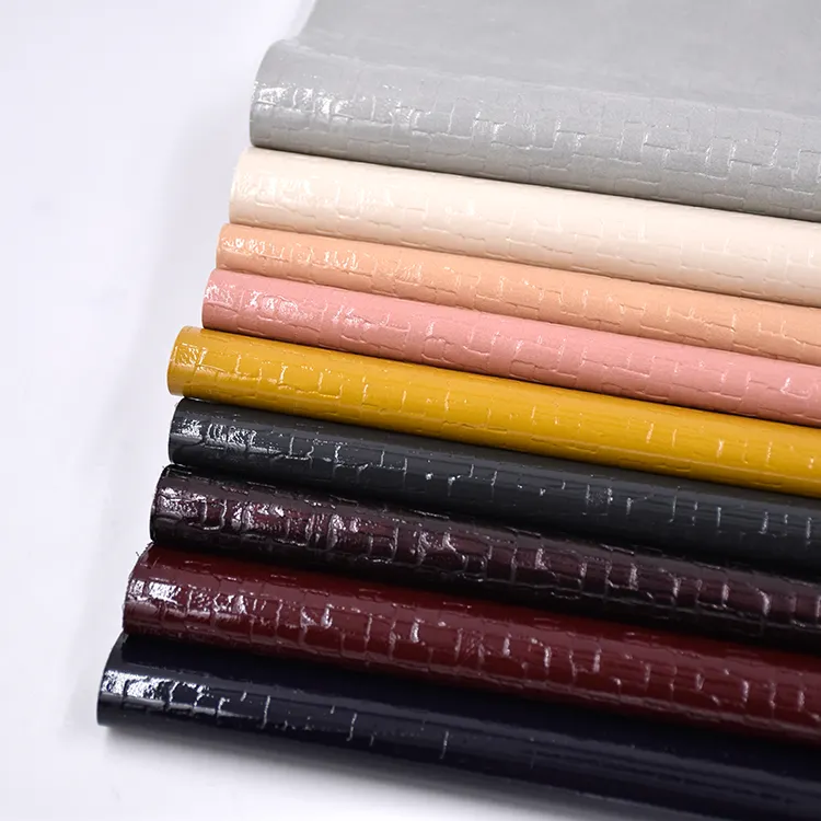 Grosir Pabrik Cina kulit minyak palsu menenun pola timbul bahan sintetis Pu kulit kain untuk tas