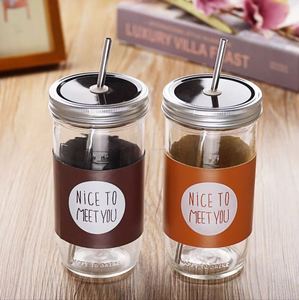 16 OZ glass mason jar with metal lid and a plastic straw
