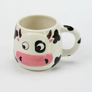 Wholesale embossed milk cup ceramic cow coffee mug for kids