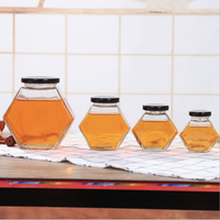 Grosir harga elegan desain tersedia ukuran yang berbeda stoples madu tingkat makanan kemasan stoples madu kaca unik