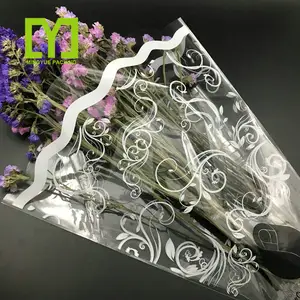 Fabricant de Yiwu sac d'opp en plastique manches d'emballage sacs d'emballage de bonbons de fleurs étanches à l'humidité gravure impression fleur Shopping