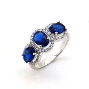 Oval Blue Sapphire & White Diamond Ladies 3 Stone Halo Engagement Rings