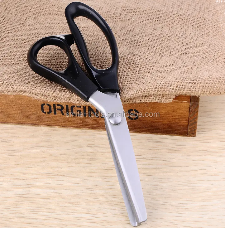 German tailor pinking wave blade scissors to cut cloth