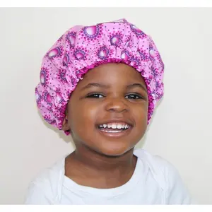 Fábrica de proveedores de China, venta al por mayor, gorro forrado de pelo largo de satén de seda para niños con logotipo personalizado para dormir al bebé