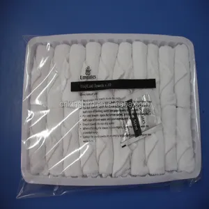 Hot and cold airline towel in tray with plastic tong