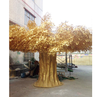 Grand arbre artificiel en fibre de verre à feuilles dorées avec la maison