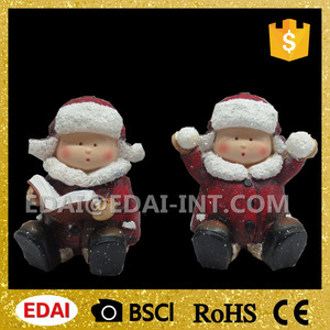 Lindo polystone sentado niño y niña figuras la lectura de libros y jugar con bola de nieve - Product Image 1