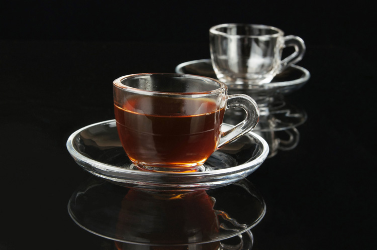 Clear glass coffee cup set with handle and saucer