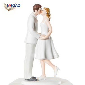 Leaning on a globus kiss statuette couple ceramics wedding cake toppers - Product Image 1