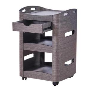 Donkergrijs hout schoonheidssalon trolley