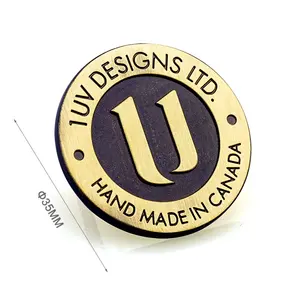 I produttori di etichette con Logo in metallo rotondo su misura per borse, etichetta di targhetta in metallo antico spazzolato per borse - Product Image 1