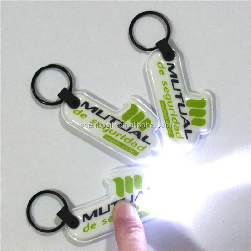 OEM custom soft pvc led light keychain , plastic flashlight keyring printing your logo and shape