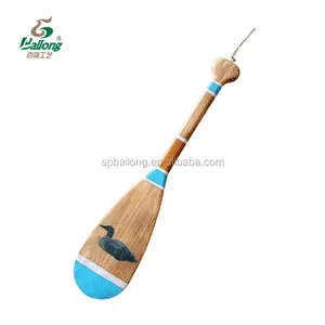 Versandfertige Wohndekorationen: Handbemalte Tier-Wanddekorationen aus Holz – Drachenboot, Kanu, dekorative Paddel - Product Image 2