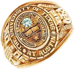 The gold plated university ring of Texas at Austin for graduaction ceremony