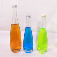 Fournisseur chinois Meilleur vendeur evian Bouteille d'eau minérale pour boisson Bouteille en verre d'eau gazeuse de source avec bouchon en alun 330ml