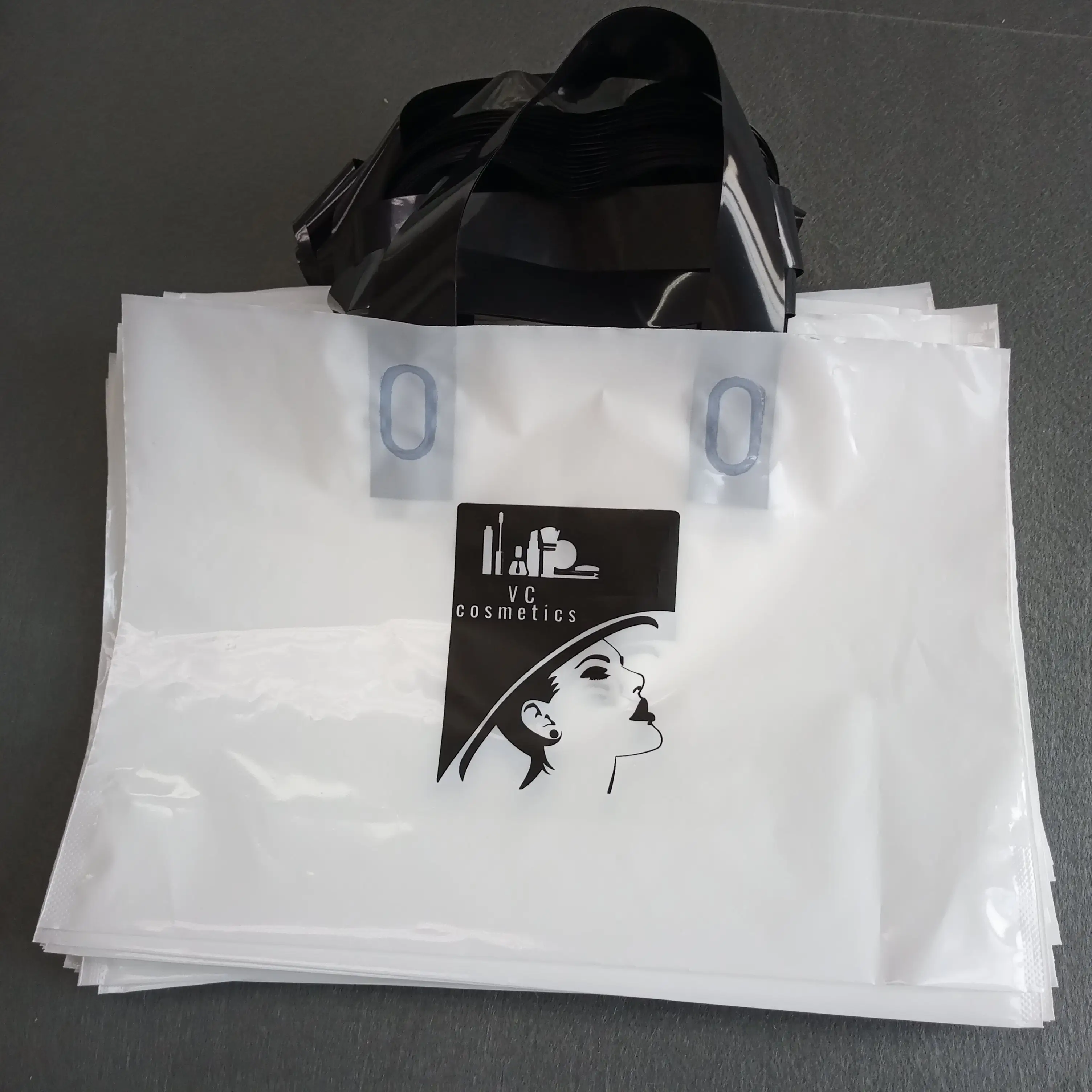 Biodegradable retail clothing shopping package custom printed coloured plastic die cut handle bag reusable shopping bag