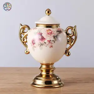 Aufwändiges Design hochwertige Waren Creme und Gold Porzellan benutzer definierte Topf Keramik Siegel Vorrats glas mit Blume