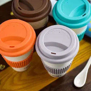 Özel Logo eko dostu su şişesi bambu elyaf kahve fincanı plastik kahve kupası silikon kol ve kapaklı