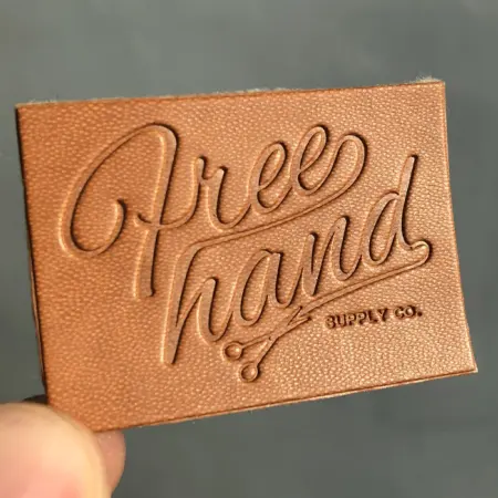 2019 Hoge Kwaliteit Hot Stamping Custom Logo Kleding Reliëf Echt Leer Label Patches Voor Jeans En Tassen