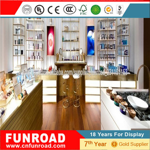 Mostradores expositivos escaparate de pared para tiendas cosmeticas con <span class=keywords><strong>vitrina</strong></span> central y modulos de pared de estilo <span class=keywords><strong>elegante</strong></span> - Product Image 1