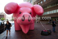 Grand cochon rose gonflable, cochon publicitaire de dessin animé